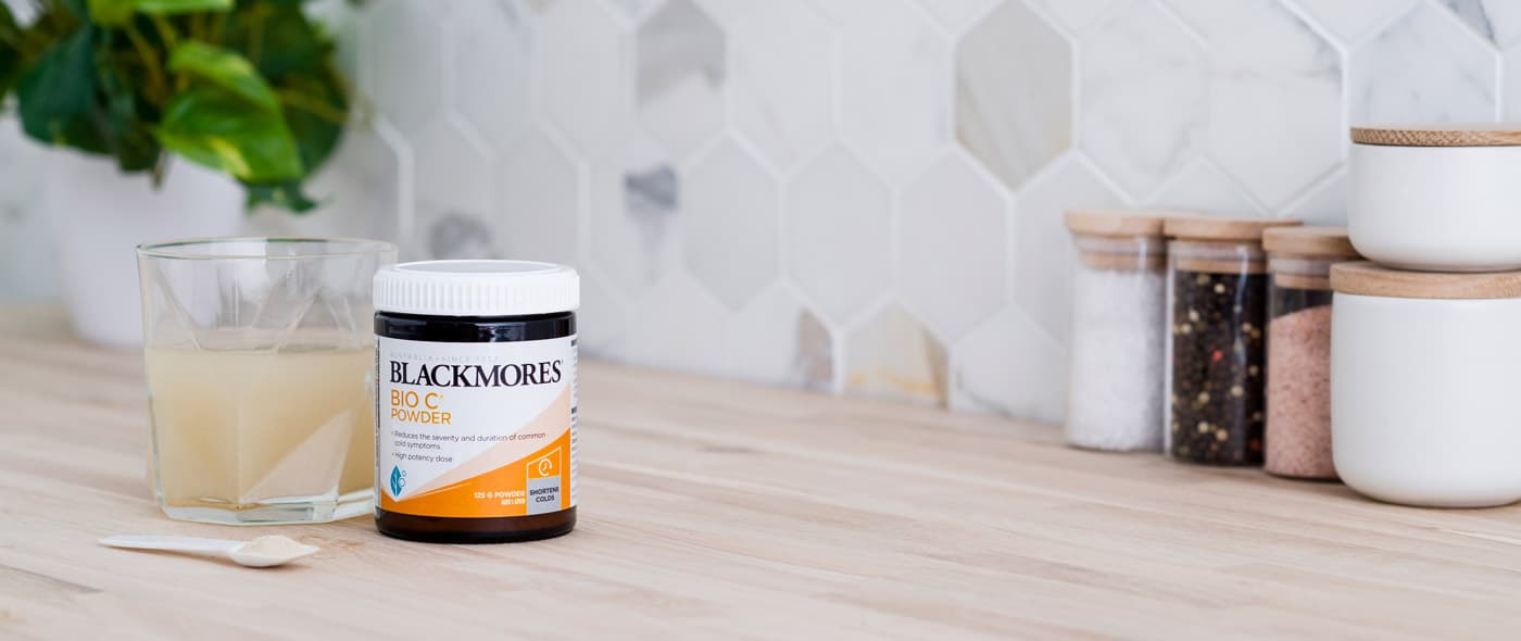 Blackmores Bio C Powder with scoop on the kitchen bench